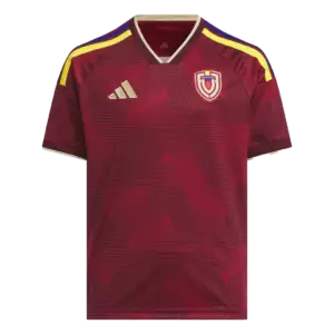Camiseta de la selección de Venezuela para el Mundial 2026 - Equipación local color vinotinto con detalles dorados.