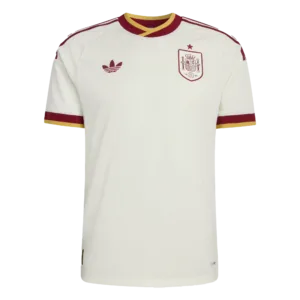 Camiseta de la selección de España para el Mundial 2026 - Equipación visitante blanca con detalles en granate y dorado.