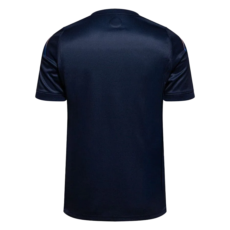 Dorsal de la camiseta de la selección de Uruguay para el Mundial 2026 - Equipación visitante azul marino con diseño de rayos solares en la espalda.